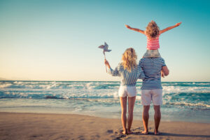 Happy family having fun on summer vacation / blog - how to make the most of your spring break
